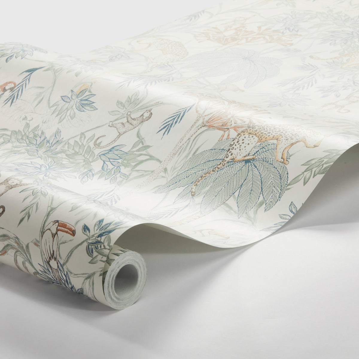 Pastel botanical wallpaper roll with blue, green, peach leaves and flowers on white; rolled corner visible.