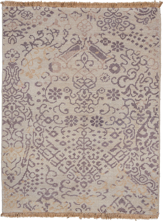 Beige rug with lavender damask floral pattern and fringed edges.
