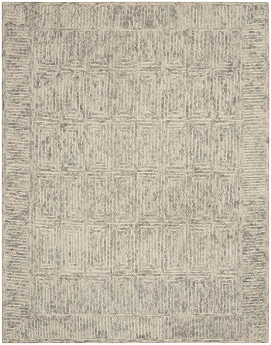 Neutral beige and gray area rug with a geometric lattice pattern and border; rectangular, cozy living-room style.
