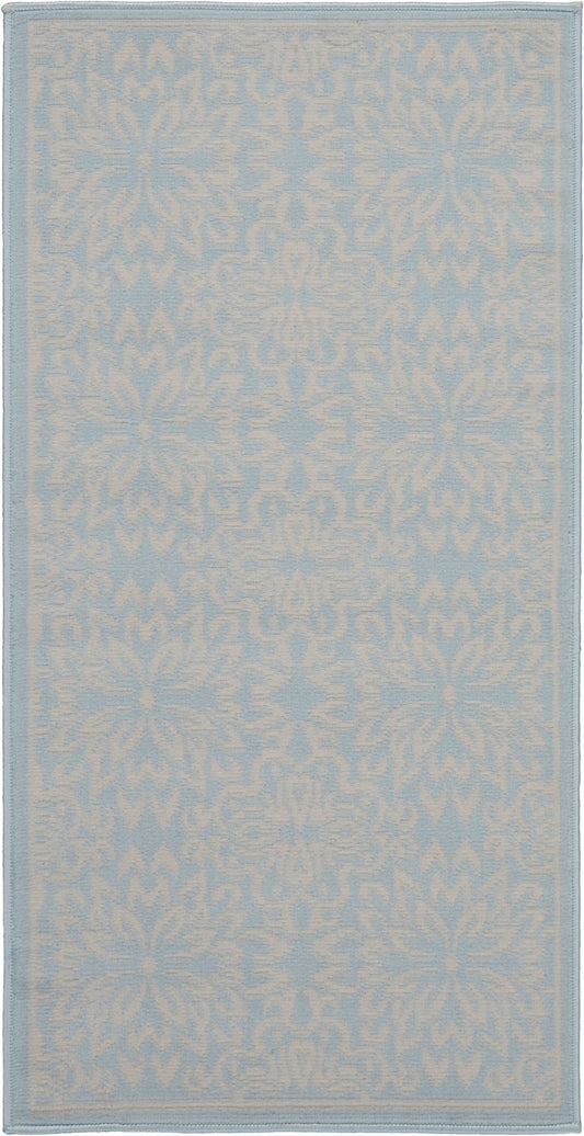 Pale blue rug with a white damask floral motif; rectangular rug with a matching border.