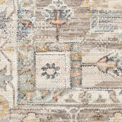 Close-up of a plush oriental rug with cream, taupe, blue and yellow geometric motifs.