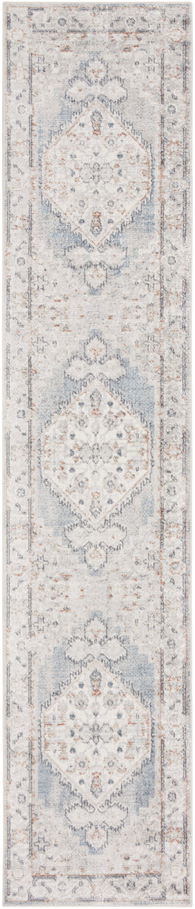 Long oriental runner rug in pale ivory with powder blue and gray accents, ornate central medallions and decorative border.