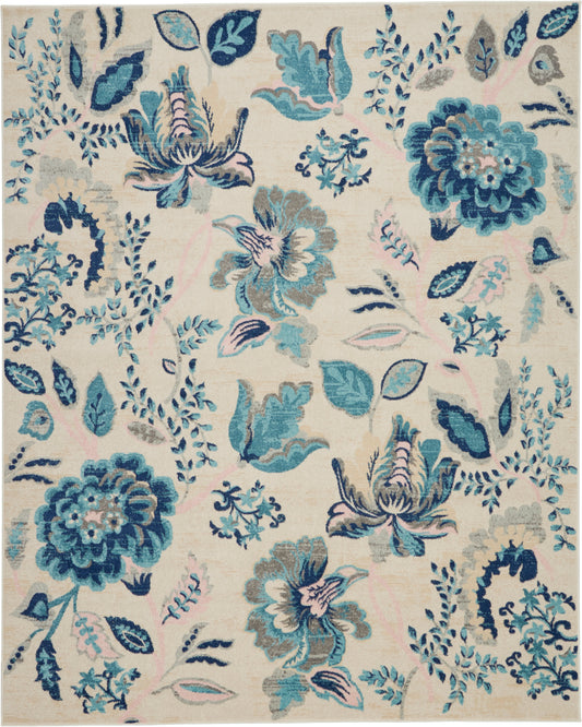 Beige area rug with large teal-blue floral pattern and pink accents; botanical decorative rug for living room.