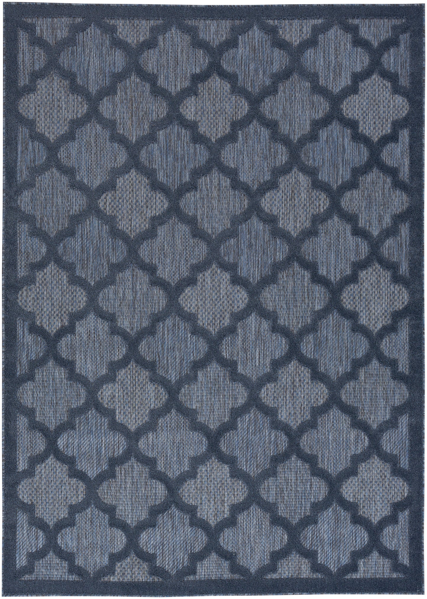 Navy blue area rug featuring a repeating quatrefoil lattice pattern in lighter blue with a textured woven look.