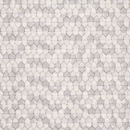 Beige and taupe woven fabric with a repeating hollow oval lattice pattern; delicate upholstery or drapery textile.