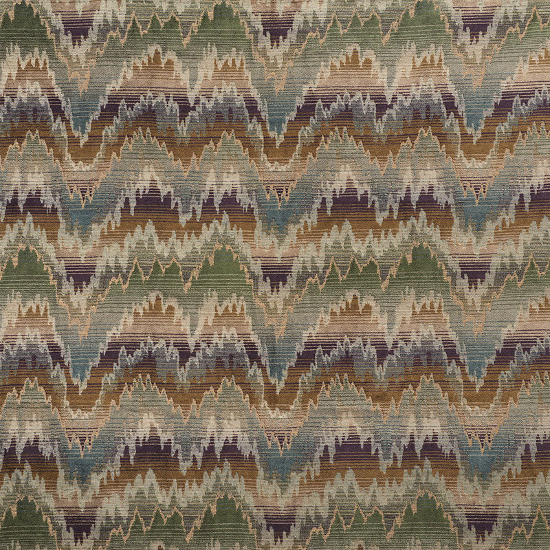 Multicolor chevron ikat rug in muted greens, browns, teal & plum; woven textile for living room decor.