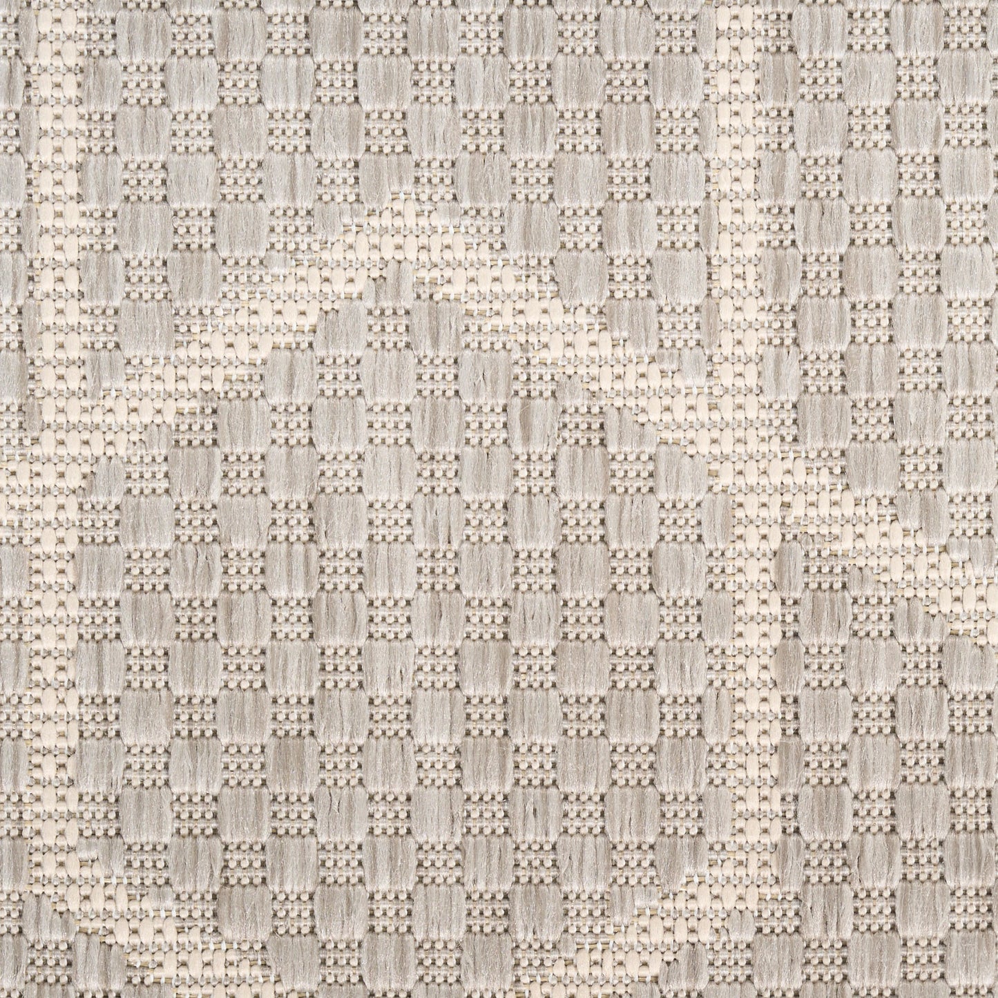 Beige textured woven fabric featuring large curved arc motif & checkered weave; ideal for upholstery.