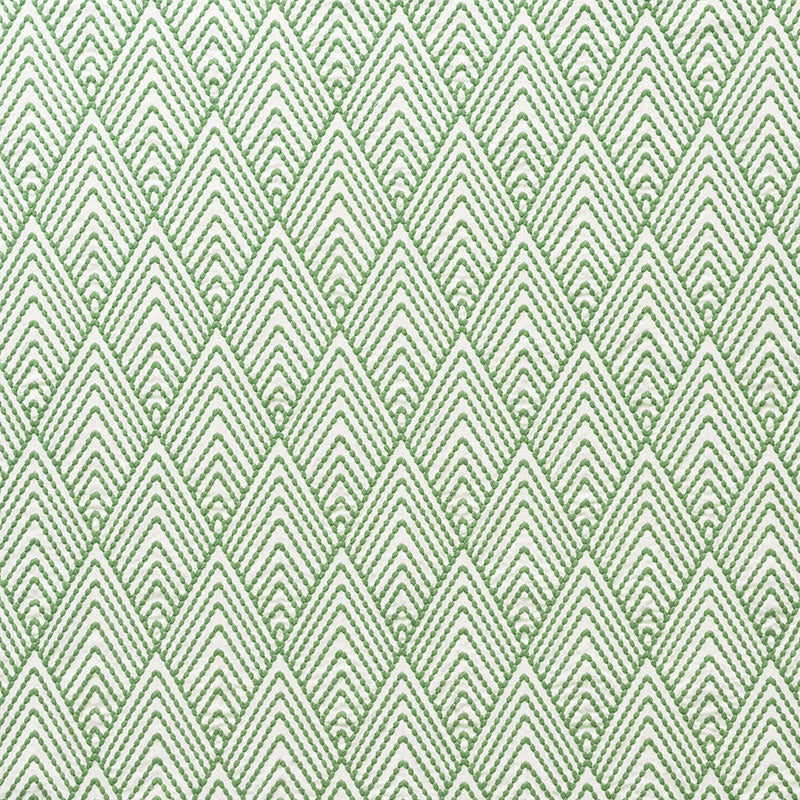 Green and white diamond chevron fabric pattern, repeating geometric motif.