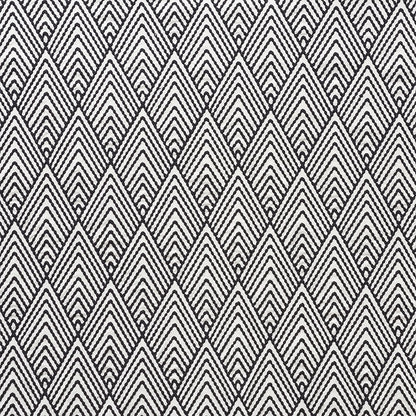 Black and white geometric diamond chevron fabric; woven textile with repeating V-shaped motifs.
