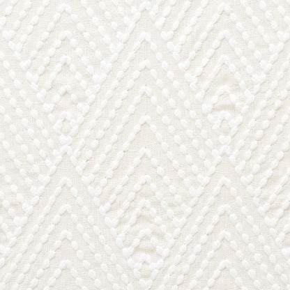 Ivory embroidery fabric with raised dotted chevron pattern and geometric diamond motifs.
