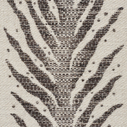 Zebra-print brown and cream woven textile with textured surface; perfect for rug or throw.