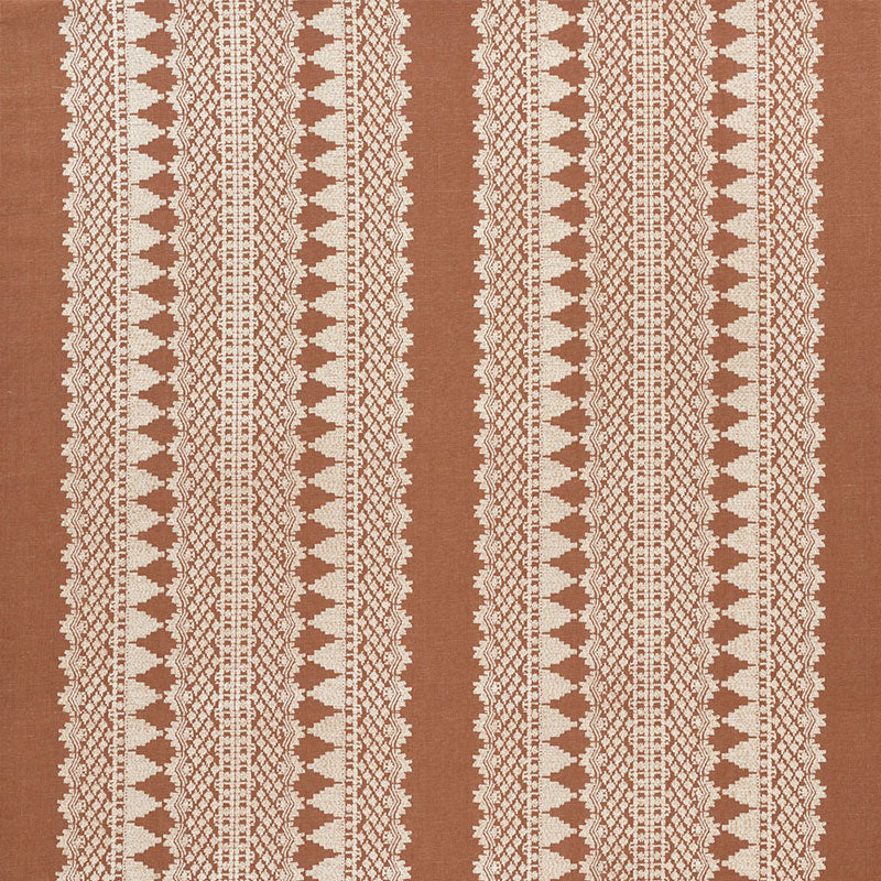 Brown textile with white vertical lace-like stripe motifs; rustic woven rug or table runner.