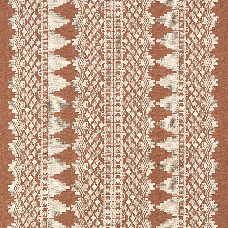 Rust brown and cream woven textile with geometric tribal pattern and vertical stripes; boho upholstery fabric/throw.