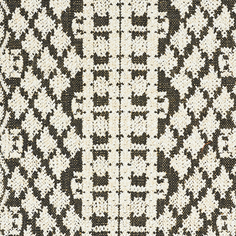Brown & cream textured woven fabric with repeating diamond motifs; versatile upholstery or throw pillow material.