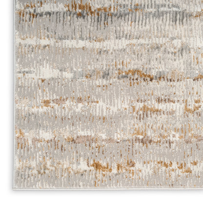 Abstract gray-beige rug with textured tufted pattern and light tan accents.