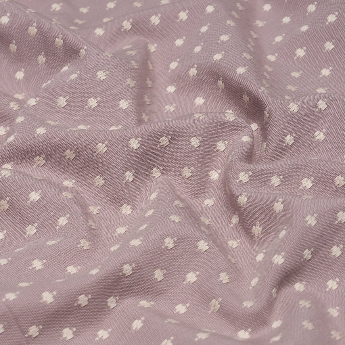 Lavender dotted Swiss cotton fabric with tiny white dots; soft, breathable, ideal for dresses.
