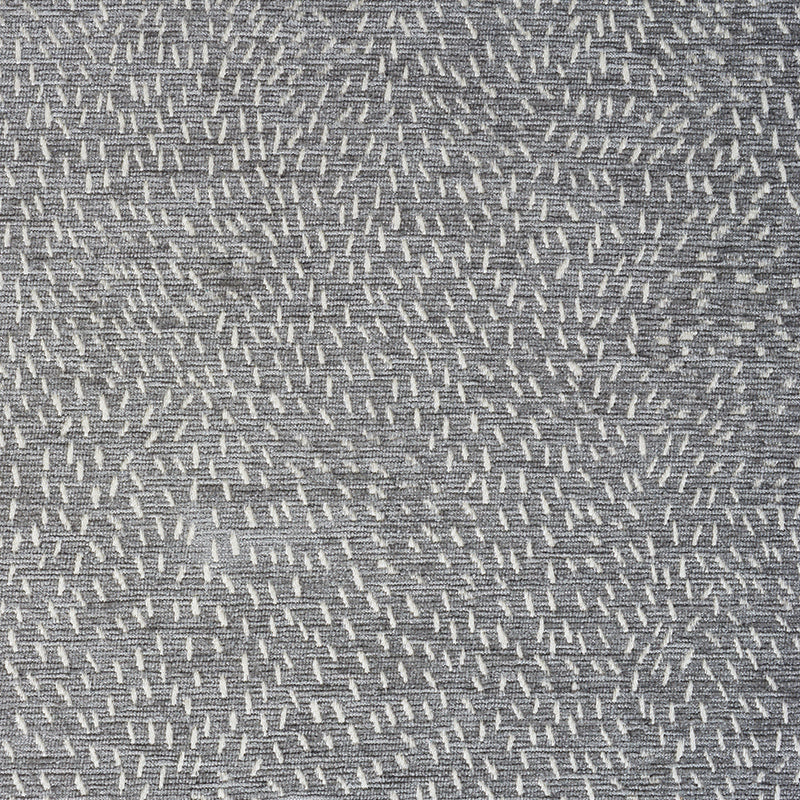 Grey woven fabric with small white dash stitches forming a speckled diagonal pattern; soft upholstery textile.
