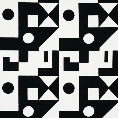 Black and white geometric tile pattern with squares, circles and triangles in a repeating modular grid.