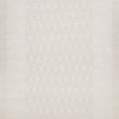 Beige woven rug with subtle repeating floral motif and textured borders; soft, neutral, versatile home decor.