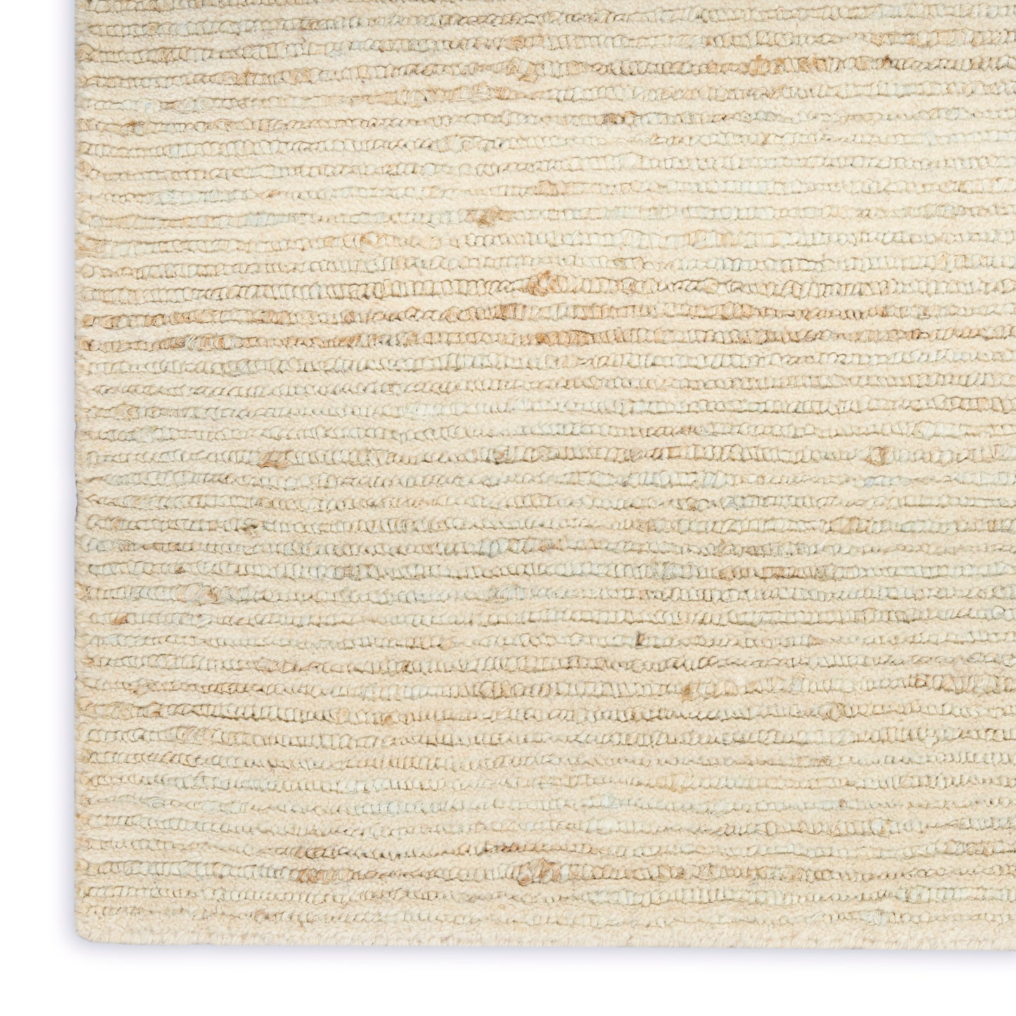 Cream looped-pile rug close-up with beige textured weave; corner of a rectangular, soft coastal-style rug.