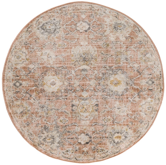 Round vintage rug with distressed floral pattern in peach, ivory, gray and pale yellow, with a soft pink edge.