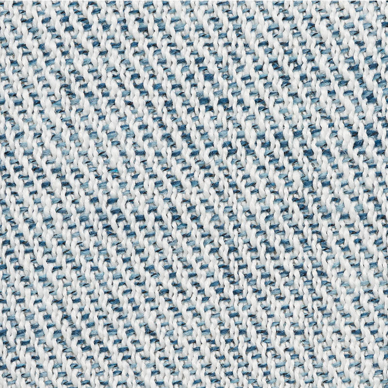 Close-up of light blue and white denim fabric showing a woven twill texture.
