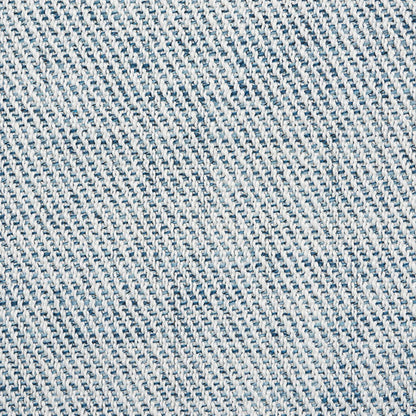 Light blue denim fabric close-up with diagonal twill weave; cotton jean material for casual wear.