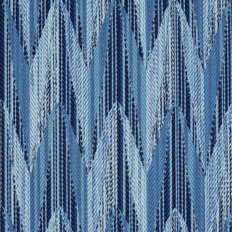 Blue chevron pattern woven fabric with a textured weave in light and dark blue tones.