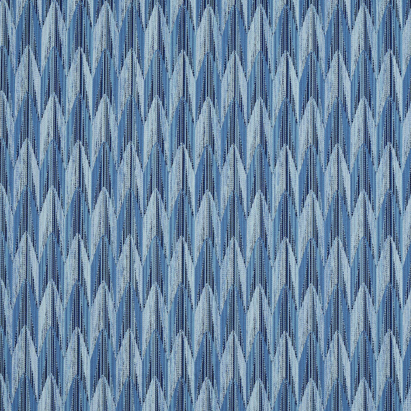 Denim-like blue chevron pattern fabric texture with light and dark indigo tones.