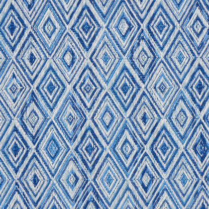 Woven textile featuring a repeating blue diamond lattice in light and dark blue tones, decorative geometric pattern.