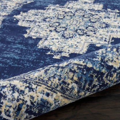 Navy blue distressed oriental rug with cream motifs; soft woven texture & rolled edge.