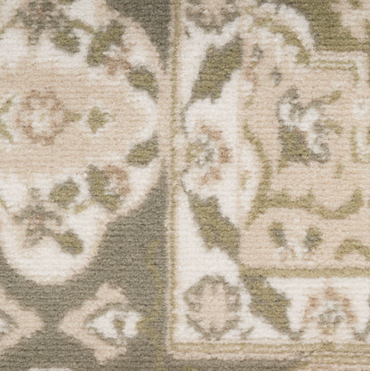 Beige and cream damask rug close-up with floral medallions and scrollwork; soft textured pile.
