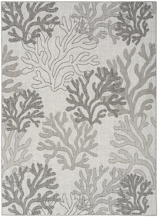 Gray coral reef pattern rug with abstract seaweed motifs set against an off-white background.