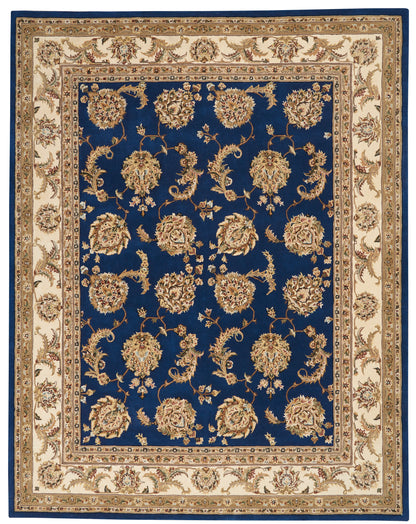Royal blue oriental area rug with gold floral motifs on a deep blue field and cream borders.