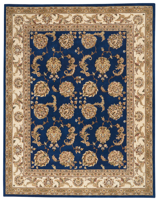 Royal blue oriental area rug with gold floral motifs on a deep blue field and cream borders.