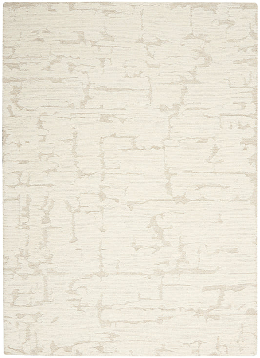 Cream rectangular rug with subtle taupe abstract crackle pattern; soft textured, modern minimalist style.