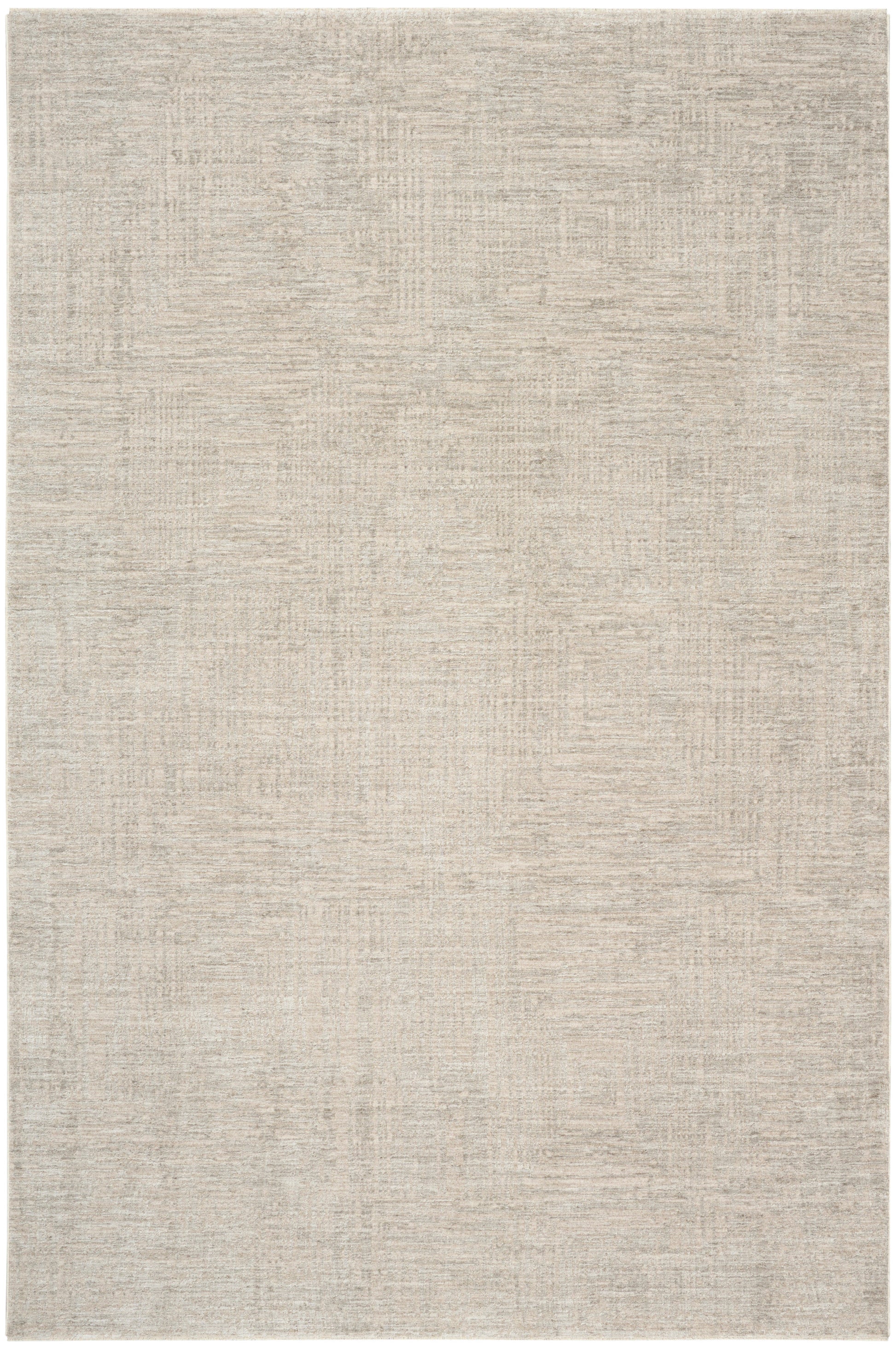 Beige rectangular area rug with a subtle distressed texture; soft, low-pile, neutral taupe tones.