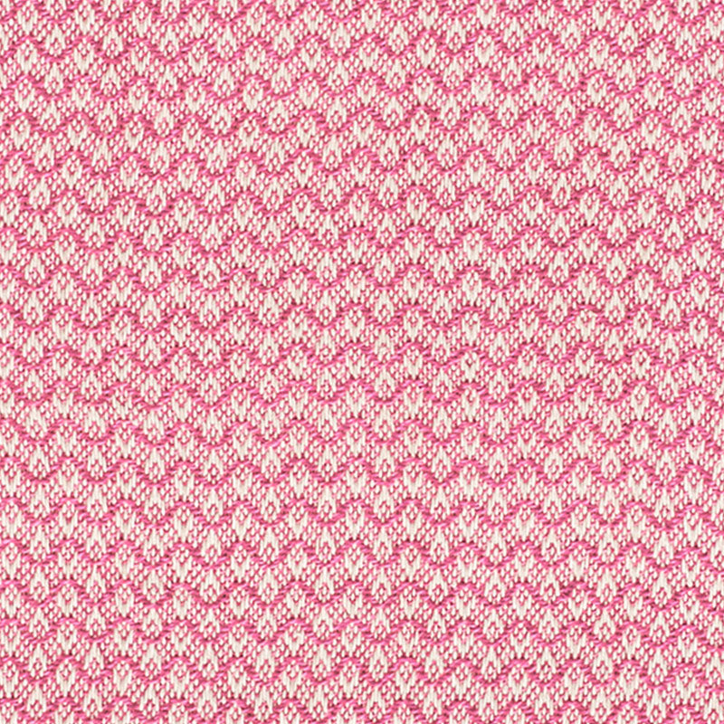 Pink and white knitted fabric with a repeating small motif; soft, cozy textile for sweaters or scarves.