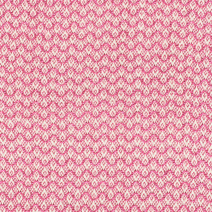 Pink and white knitted fabric with a repeating small motif; soft, cozy textile for sweaters or scarves.