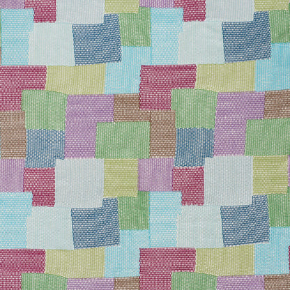 Pastel patchwork fabric with stitched squares in blue, pink, green, yellow and lavender; soft woven textile pattern.