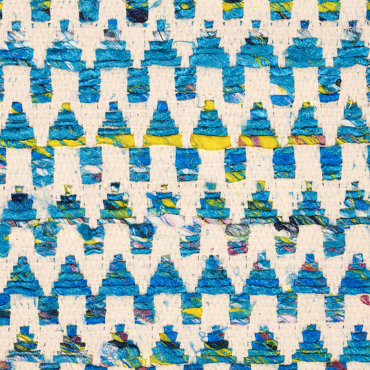 Woven fabric with repeating blue and teal triangular motifs and yellow accents.