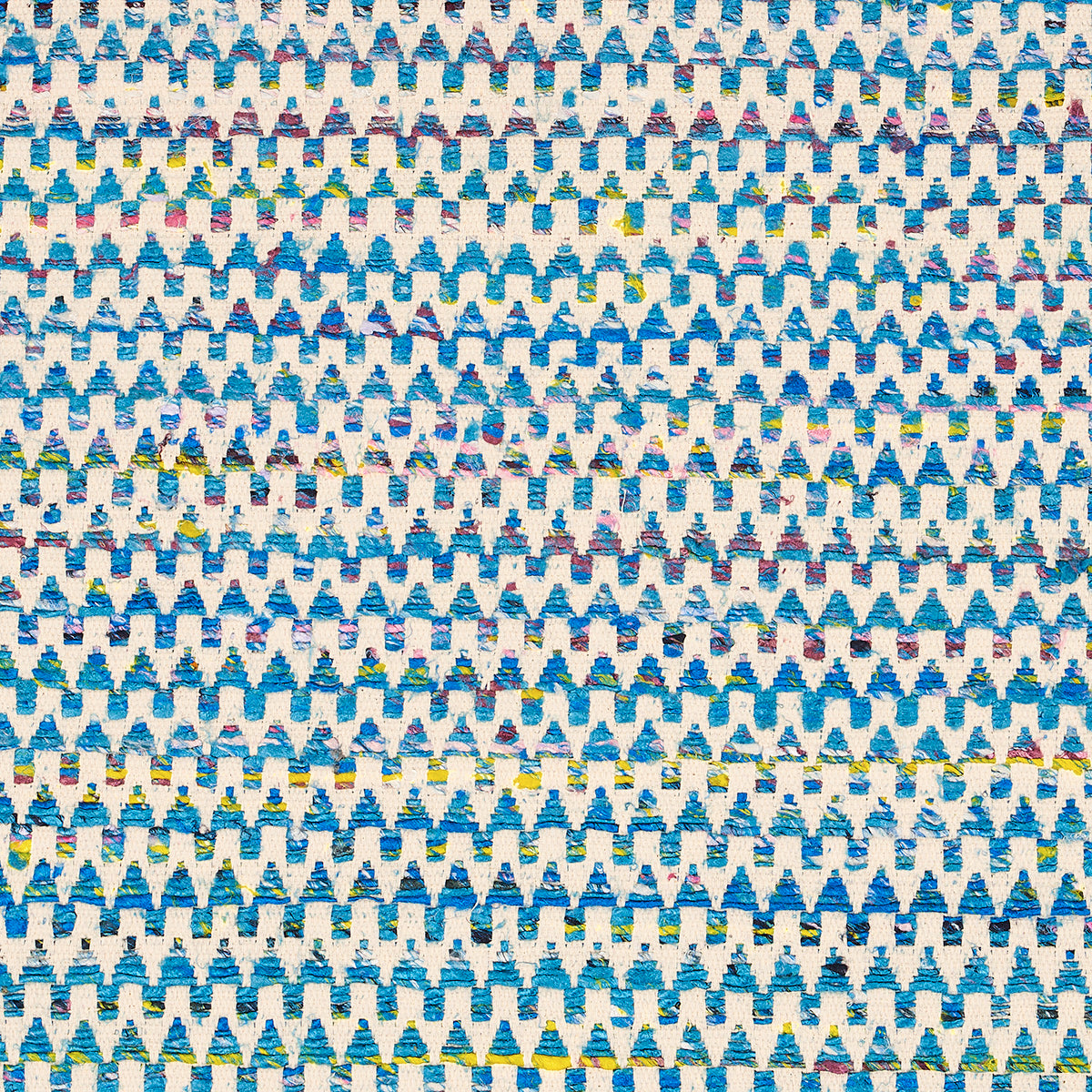Blue and white repeating triangle/tree motif fabric pattern with small yellow and green accents.