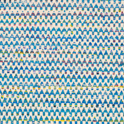 Blue and white repeating triangle/tree motif fabric pattern with small yellow and green accents.