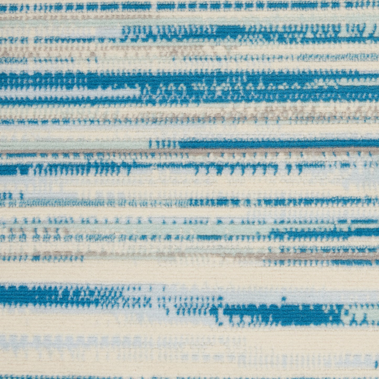 Close-up of blue and white striped woven rug texture.