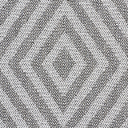 Chevron-patterned fabric strip in white & blue beside a solid gray panel; textile texture suggests upholstery or garment.