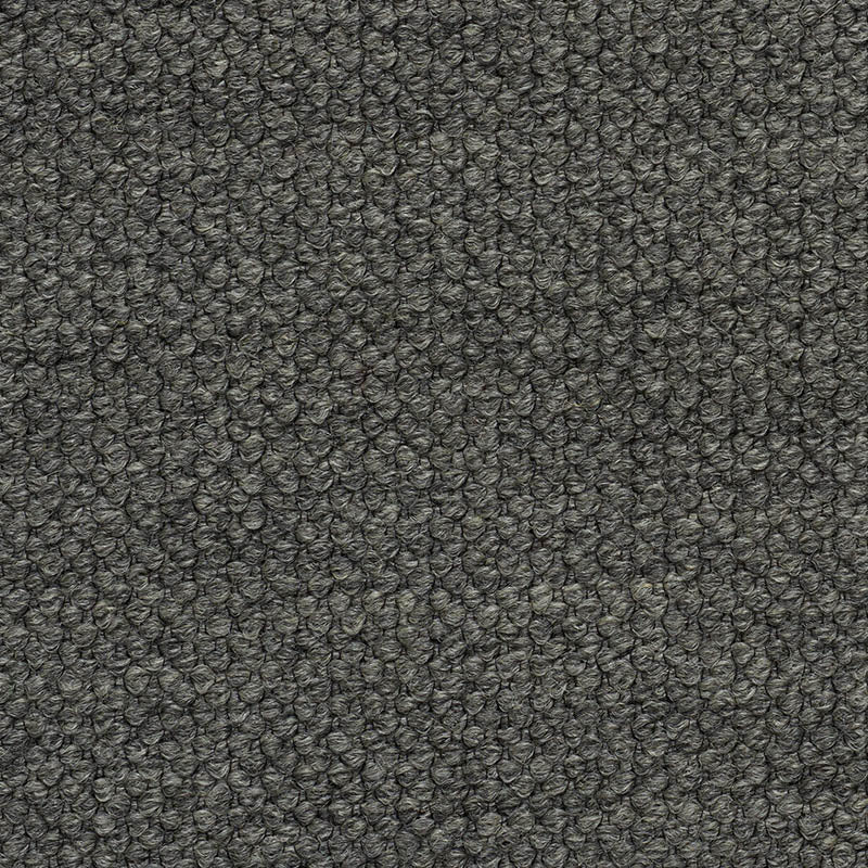 Charcoal grey boucle fabric close-up with tiny looped texture, dense and soft for upholstery or jackets.