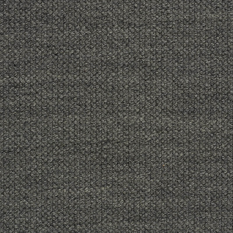 Dark gray boucle fabric close-up with tiny loop texture; upholstery material for sofa or chair.