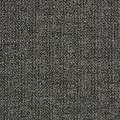 Dark gray boucle fabric close-up with tiny loop texture; upholstery material for sofa or chair.