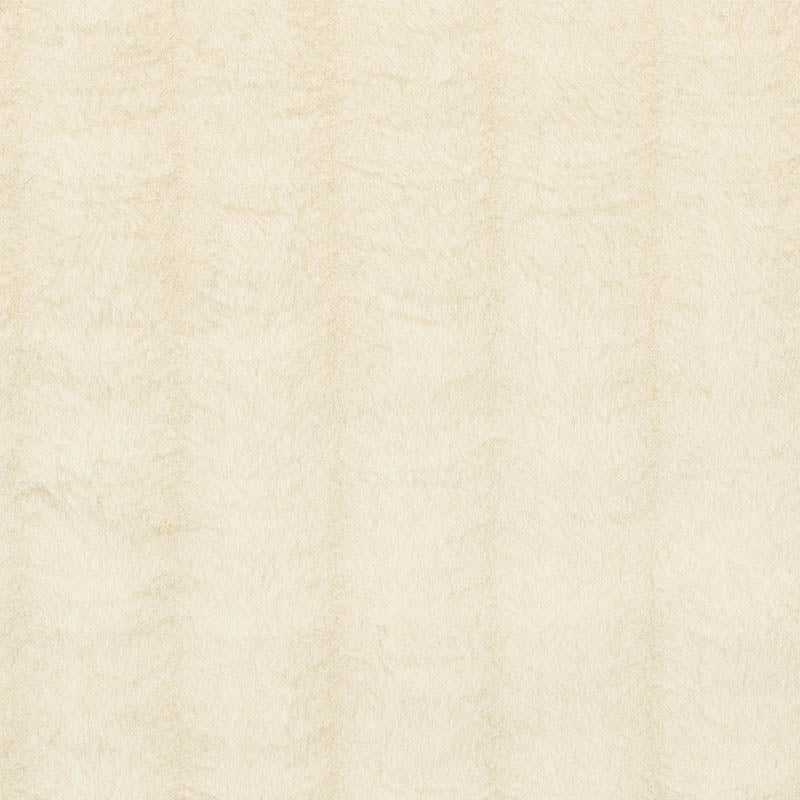 Cream textured fabric or parchment-like beige surface with subtle vertical grain.