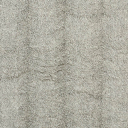 Beige plush fabric with soft nap and subtle textured surface.